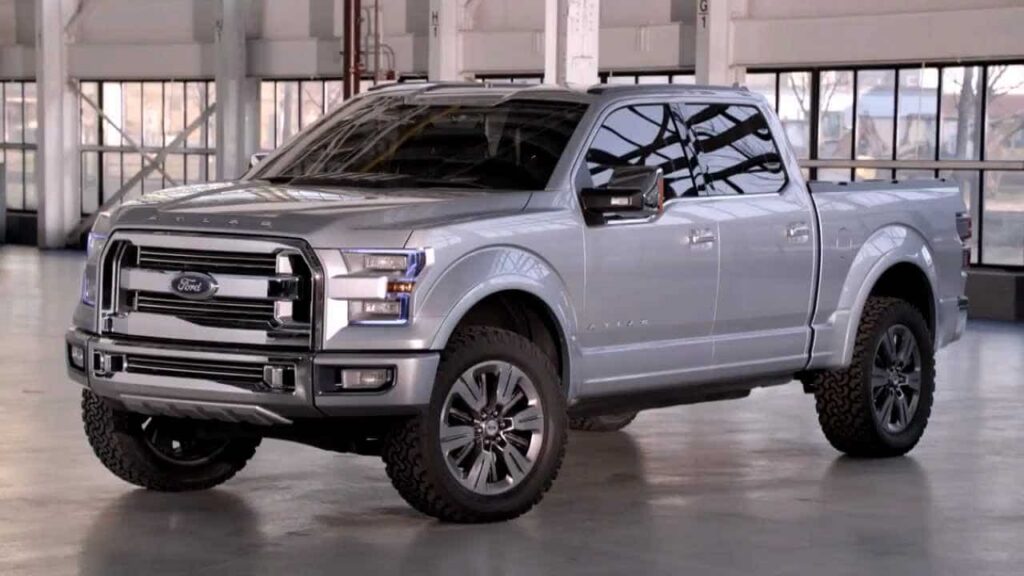 A silver Ford F-150 pickup truck parked indoors.