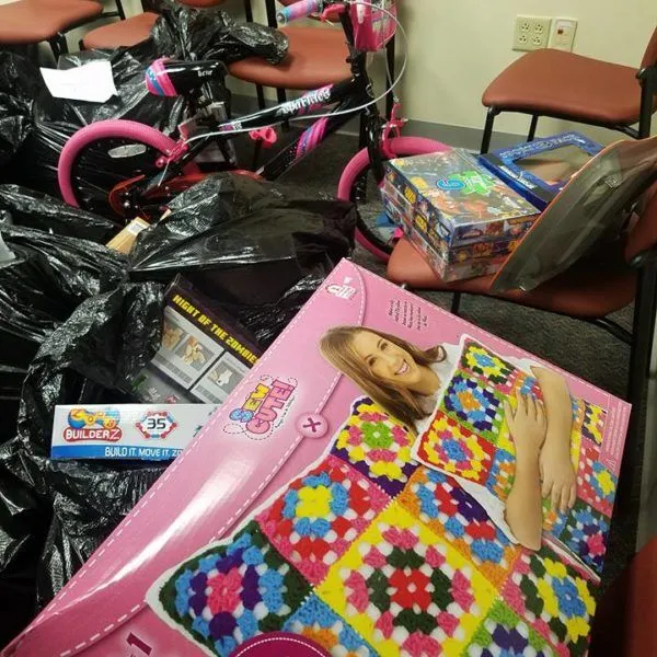 Children’s toys are arranged on chairs with garbage bags.